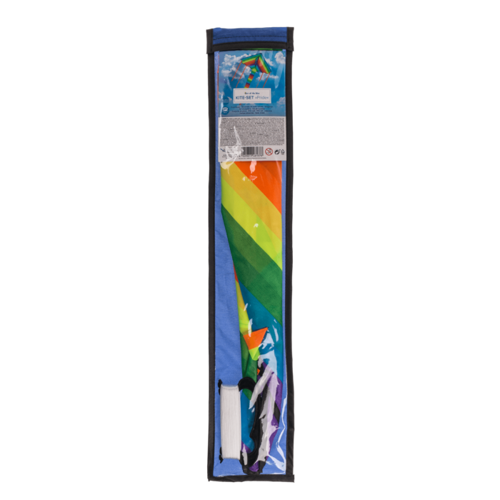 Verpacktes Regenbogen-Drachenset in transparenter Hülle mit sichtbarem buntem Drachenstoff und aufgewickelter Schnurspule.