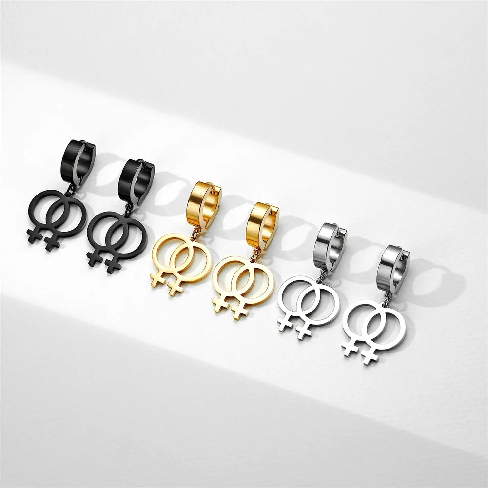 Lesbische Creolen mit Doppel-Venus-Symbol in Schwarz, Gold und Silber als LGBTQ+ Pride Ohrringe.