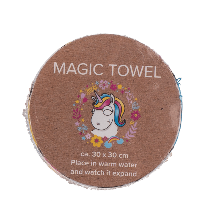 Komprimiertes magisches Einhorn-Baumwollhandtuch („Magic Towel“) in runder Form vor dem Entfalten