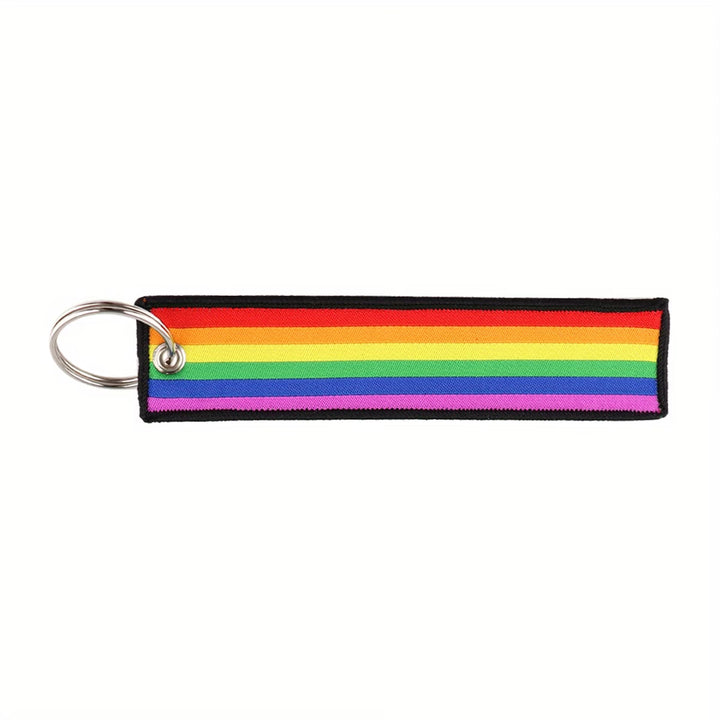 Regenbogen Schlüsselanhänger aus Polyester mit Metallring, ca. 13 × 3 cm.