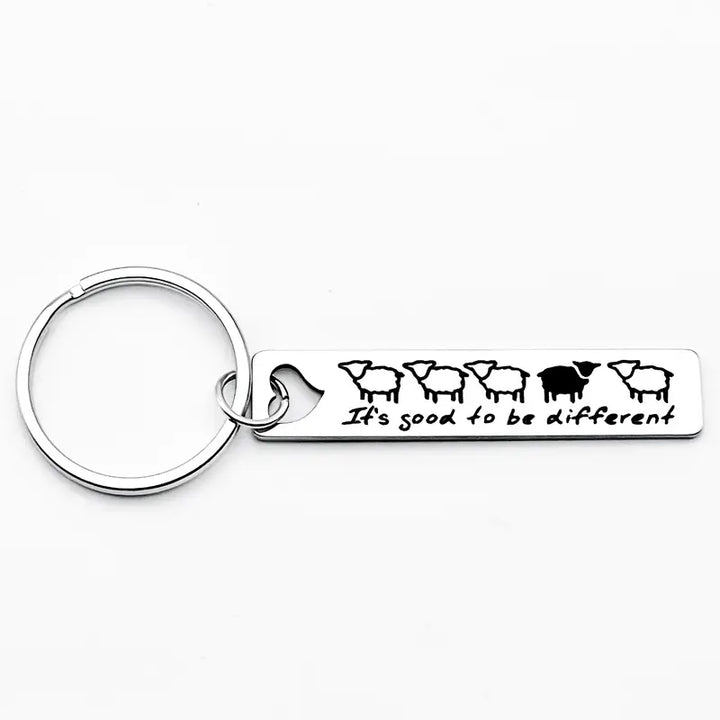 Schlüsselanhänger aus Metall mit Schaf-Motiv und Schriftzug „It’s good to be different“, Symbol für Individualität