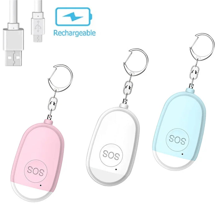 Ein Set aus drei tragbaren SOS-Alarmgeräten in den Farben Rosa, Weiß und Türkis. Jedes Gerät verfügt über einen Schlüsselanhänger und einen USB-Ladeanschluss. Ideal für den persönlichen Schutz und Notfälle.