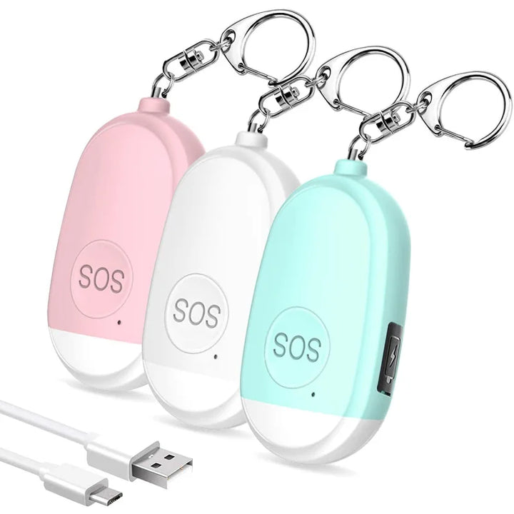Ein Set aus drei tragbaren SOS-Alarmgeräten in den Farben Rosa, Weiß und Türkis. Jedes Gerät verfügt über einen Schlüsselanhänger und einen USB-Ladeanschluss. Ideal für den persönlichen Schutz und Notfälle.