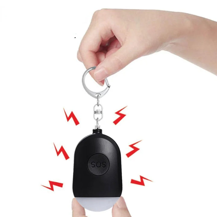 Tragbares SOS-Alarmgerät. Jedes Gerät verfügt über einen Schlüsselanhänger und einen USB-Ladeanschluss. Ideal für den persönlichen Schutz und Notfälle.
